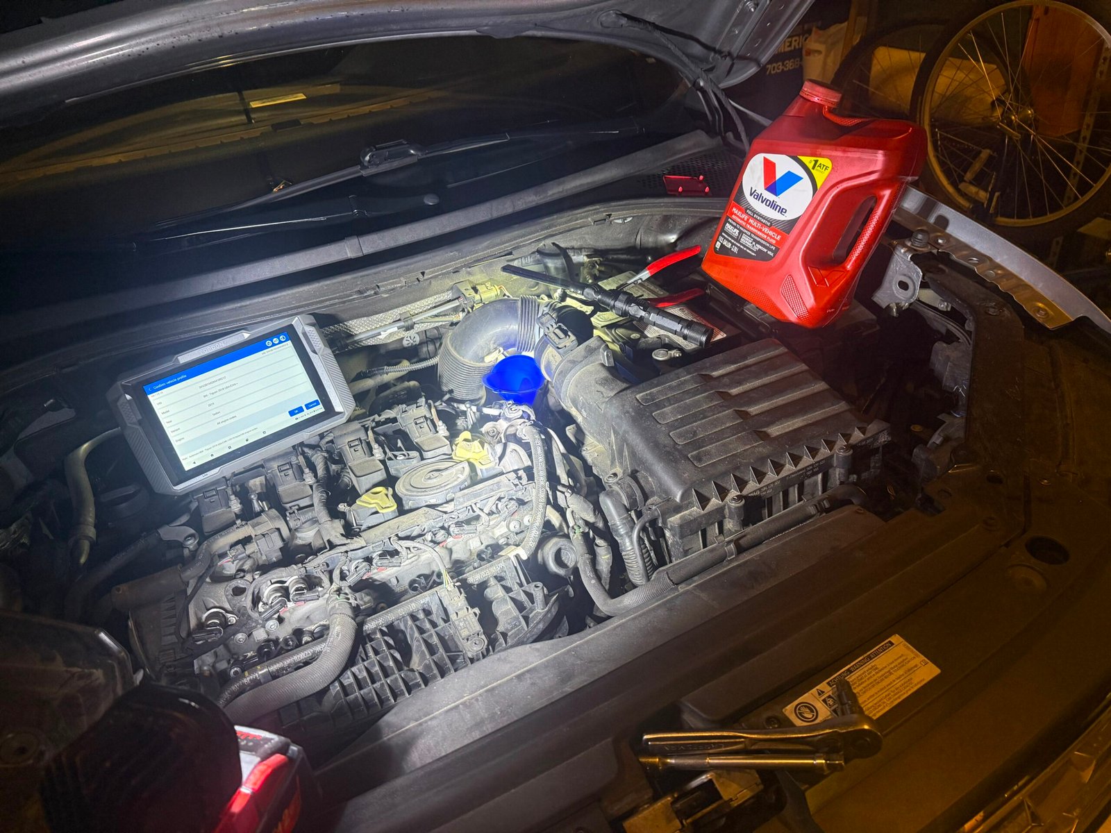 Octopus Group mobile mechanic working on a vehicle engine on-site